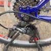 Close-up of mountain bike gear system and chain for optimal performance.