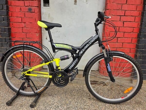 Full suspension mountain bike with black and yellow frame for off-road riding.